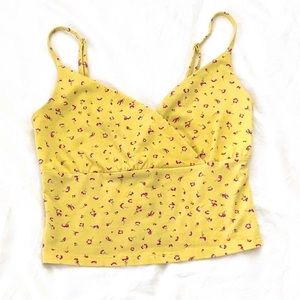Yellow tank top with a floral pattern size small